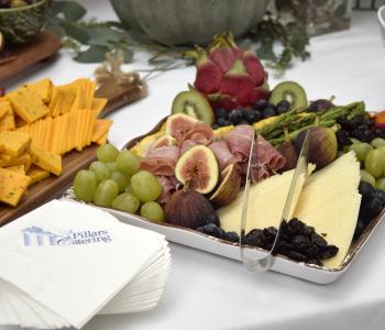Closeup of charcuterie foods plated on a table